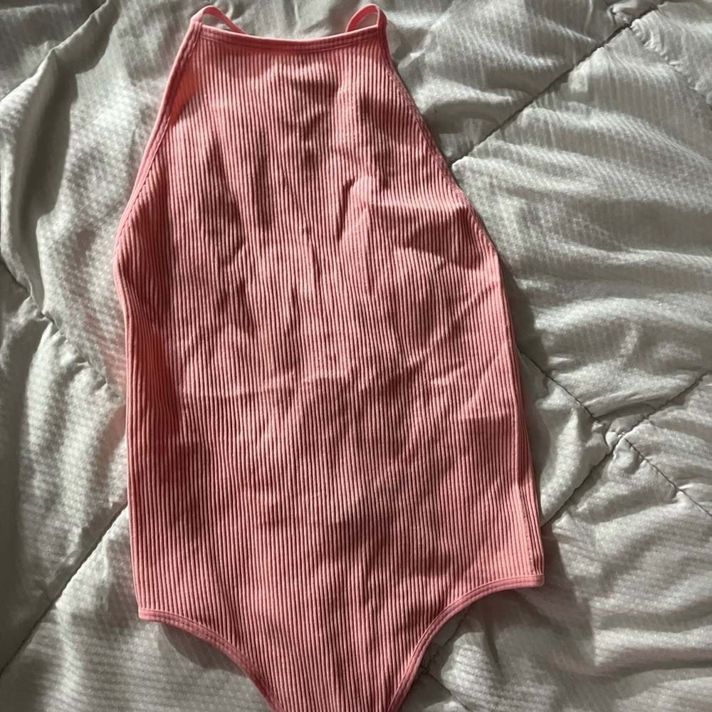 Woman’s small pink bodysuit